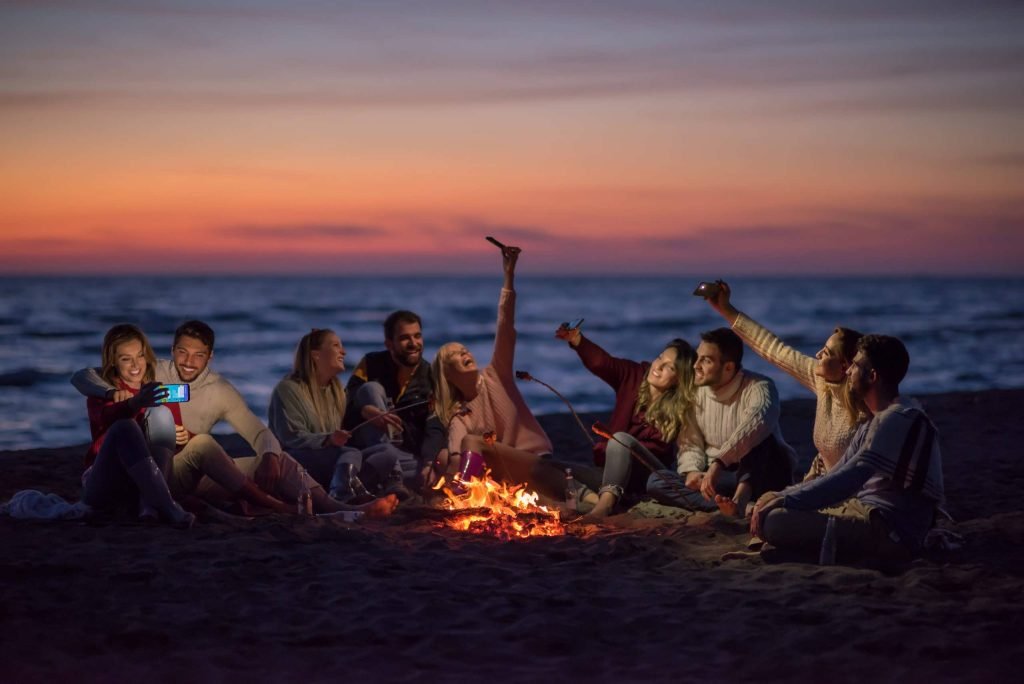 a-group-of-friends-enjoying-bonfire-on-beach